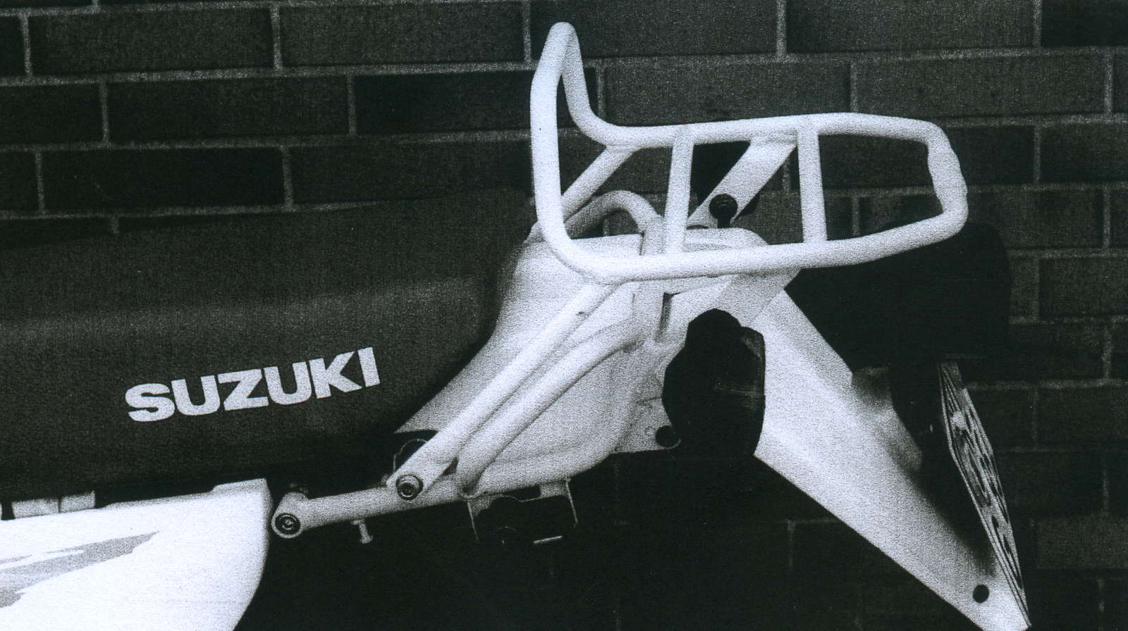 Topcase carrier tube-type black for Suzuki DR 125 SE (1995-1998)